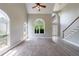 Open living room features plush carpeting, lots of light, and staircase at 1523 Fallen Leaf Dr, Marietta, GA 30064