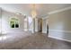 Bright living room featuring a vaulted ceiling, neutral paint, and a modern chandelier for an inviting atmosphere at 1523 Fallen Leaf Dr, Marietta, GA 30064