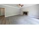 Spacious living room features a stone fireplace, plush carpeting, and neutral paint at 1523 Fallen Leaf Dr, Marietta, GA 30064