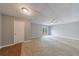 Large living room featuring tiled section, neutral paint, and a patio door at 1523 Fallen Leaf Dr, Marietta, GA 30064