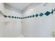 Tiled shower with decorative accents at 1523 Fallen Leaf Dr, Marietta, GA 30064