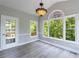 Sunroom with lots of windows, door to outside and a hanging light fixture at 1523 Fallen Leaf Dr, Marietta, GA 30064