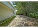 Spacious backyard surrounded by mature trees, offering a private outdoor retreat at 1528 Rogers Crossing Dr, Lithonia, GA 30058
