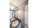 This bathroom features a dark granite countertop and a large mirror at 1528 Rogers Crossing Dr, Lithonia, GA 30058