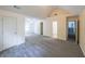 Spacious bedroom with neutral carpet, ceiling fan and a vaulted ceiling at 1528 Rogers Crossing Dr, Lithonia, GA 30058
