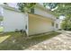 Back exterior view of home with vinyl siding and a grassy yard at 1528 Rogers Crossing Dr, Lithonia, GA 30058
