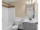 Guest bathroom featuring a tub with tiled accent and updated vanity at 202 Windcroft Nw Ct, Acworth, GA 30101