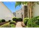 Beautiful exterior featuring a stone accent and lush landscaping around a sidewalk at 202 Windcroft Nw Ct, Acworth, GA 30101