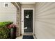 Inviting front door with decorative wreath, stone accents and landscaped surroundings at 202 Windcroft Nw Ct, Acworth, GA 30101
