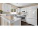 Bright white kitchen featuring ample cabinet and counter space at 202 Windcroft Nw Ct, Acworth, GA 30101
