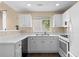 Bright kitchen featuring ample white cabinets at 202 Windcroft Nw Ct, Acworth, GA 30101