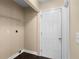 A practical laundry room with a wire shelf for storage and a door for easy access at 202 Windcroft Nw Ct, Acworth, GA 30101
