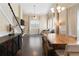 A modern and bright living room with dark floors, fireplace, and staircase at 202 Windcroft Nw Ct, Acworth, GA 30101