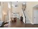Open concept living room and dining area showcasing staircase and kitchen at 202 Windcroft Nw Ct, Acworth, GA 30101