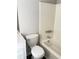 Clean bathroom featuring a shower-tub combo and a toilet with cabinet at 2115 Charter Ln, Lithonia, GA 30058