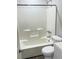Clean bathroom featuring a shower-tub combo and modern fixtures at 2115 Charter Ln, Lithonia, GA 30058