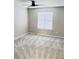 Bright bedroom with neutral walls, carpeted floor and a large window for ample light at 2115 Charter Ln, Lithonia, GA 30058