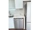 Modern kitchen featuring stainless steel dishwasher and white cabinets at 2115 Charter Ln, Lithonia, GA 30058