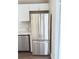 Modern kitchen featuring a stainless steel LG refrigerator and white cabinetry at 2115 Charter Ln, Lithonia, GA 30058