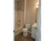 Bathroom with a shower and tub combination, white cabinet, and toilet at 6121 Joybrook Rd, Johns Creek, GA 30097