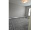 Bedroom featuring neutral walls, carpet, and a window at 6121 Joybrook Rd, Johns Creek, GA 30097