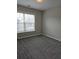 Neutral bedroom with carpet, a window, and light colored walls at 6121 Joybrook Rd, Johns Creek, GA 30097