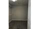 Spacious walk-in closet with white shelves and neutral carpet at 6121 Joybrook Rd, Johns Creek, GA 30097