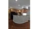 Spacious kitchen with a breakfast bar, dark appliances, and wood cabinetry at 6121 Joybrook Rd, Johns Creek, GA 30097