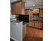 Well-appointed kitchen with wooden cabinets, granite counters, and modern black appliances at 6121 Joybrook Rd, Johns Creek, GA 30097