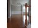 Spacious living room with hardwood floors, detailed trim, and bright windows at 6121 Joybrook Rd, Johns Creek, GA 30097