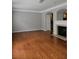 Spacious living room with hardwood floors and fireplace at 6121 Joybrook Rd, Johns Creek, GA 30097