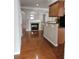 Open-concept space featuring a fireplace and view into the kitchen at 6121 Joybrook Rd, Johns Creek, GA 30097