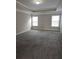 Spacious main bedroom features tray ceiling and plush carpet at 6121 Joybrook Rd, Johns Creek, GA 30097