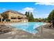 Community pool area with lounge chairs, clear blue water, and a nearby gazebo for relaxing summer days at 6121 Joybrook Rd, Johns Creek, GA 30097