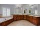 Spacious bathroom features dual vanity, a tub, and granite countertops at 1575 Spalding Dr, Sandy Springs, GA 30350