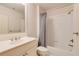 Clean bathroom featuring a white vanity, toilet, and bathtub with shower at 1575 Spalding Dr, Sandy Springs, GA 30350
