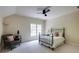 Bedroom with a chair, side table, and wrought iron bed at 1575 Spalding Dr, Sandy Springs, GA 30350