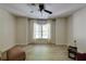 Bright bedroom featuring hardwood floors, a ceiling fan, and natural light at 1575 Spalding Dr, Sandy Springs, GA 30350
