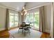 Dining room with natural light and backyard view at 1575 Spalding Dr, Sandy Springs, GA 30350