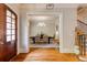 View of dining room with hardwood floors, modern chandelier and decorative stairway at 1575 Spalding Dr, Sandy Springs, GA 30350