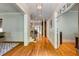 Inviting foyer featuring hardwood floors, elegant trim, and an open staircase at 1575 Spalding Dr, Sandy Springs, GA 30350