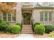 Charming entrance with brick steps, double front doors, and manicured landscaping at 1575 Spalding Dr, Sandy Springs, GA 30350