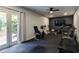 Home gym featuring workout equipment and natural light from French doors at 1575 Spalding Dr, Sandy Springs, GA 30350