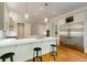 Modern kitchen with white countertops, stainless steel appliances, and bar seating at 1575 Spalding Dr, Sandy Springs, GA 30350