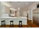Bright kitchen with white quartz countertops, stainless steel appliances and bar seating at 1575 Spalding Dr, Sandy Springs, GA 30350