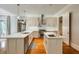 Spacious kitchen with double islands, stainless steel appliances, and modern finishes at 1575 Spalding Dr, Sandy Springs, GA 30350