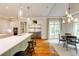Eat-in kitchen featuring an oversized refrigerator and white cabinetry at 1575 Spalding Dr, Sandy Springs, GA 30350