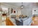 Open concept living room with hardwood floors, fireplace, and staircase at 1575 Spalding Dr, Sandy Springs, GA 30350