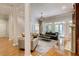 Bright living room with hardwood floors, fireplace, and glass doors leading to an outdoor space at 1575 Spalding Dr, Sandy Springs, GA 30350