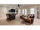 Inviting living room with hardwood floors, a sofa, chairs and a media center at 1575 Spalding Dr, Sandy Springs, GA 30350
